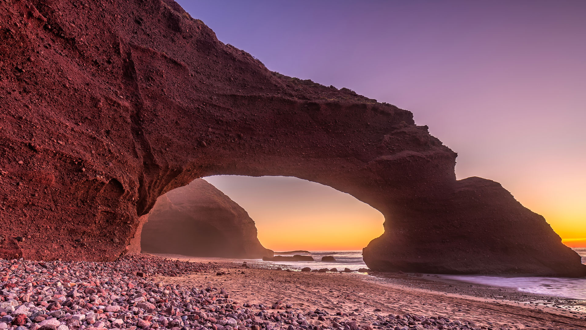 CASATRANSFERS Legzira Beach tour showcasing stunning coastal views and natural beauty in Morocco